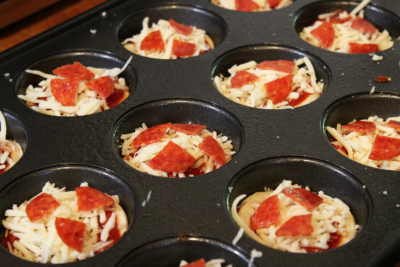 mini pizzas in muffin pan